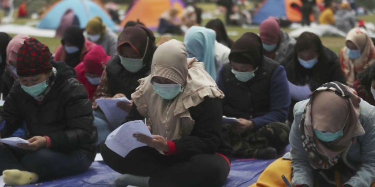 Lavoratori e lavoratrici indonesiani a Hong Kong (LaPresse)