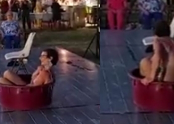 Lo spogliarello di Loretta Pompili a Rimini, durante la Festa dell'Unità (Twitter)