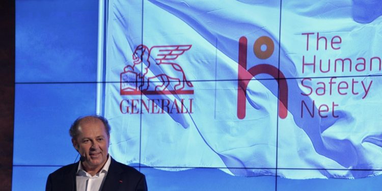 Il Ceo delle Generali Philippe Donnet presenta uno dei progetti di The Human Safety Net (Ansa)