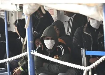 Immigrati a bordo della nave ONG Humanity arrivata nel porto di Genova (Ansa)